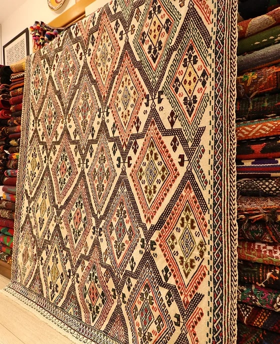 mid-century handwoven oriental rug in red and beige from Turkey