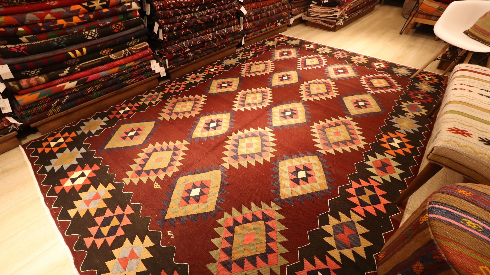 Vintage handwoven oriental Turkish rug in pastel and earth colors adorned with traditional and tribal motifs