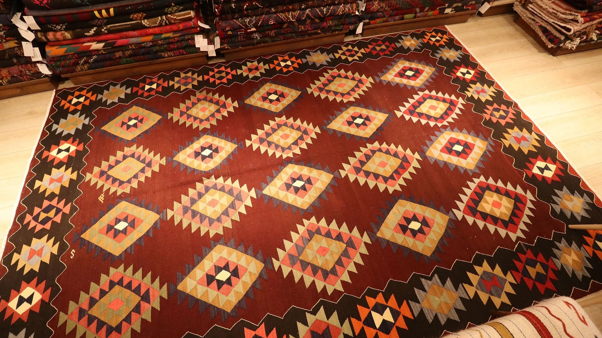 Vintage handwoven oriental Turkish rug in pastel and earth colors adorned with traditional and tribal motifs