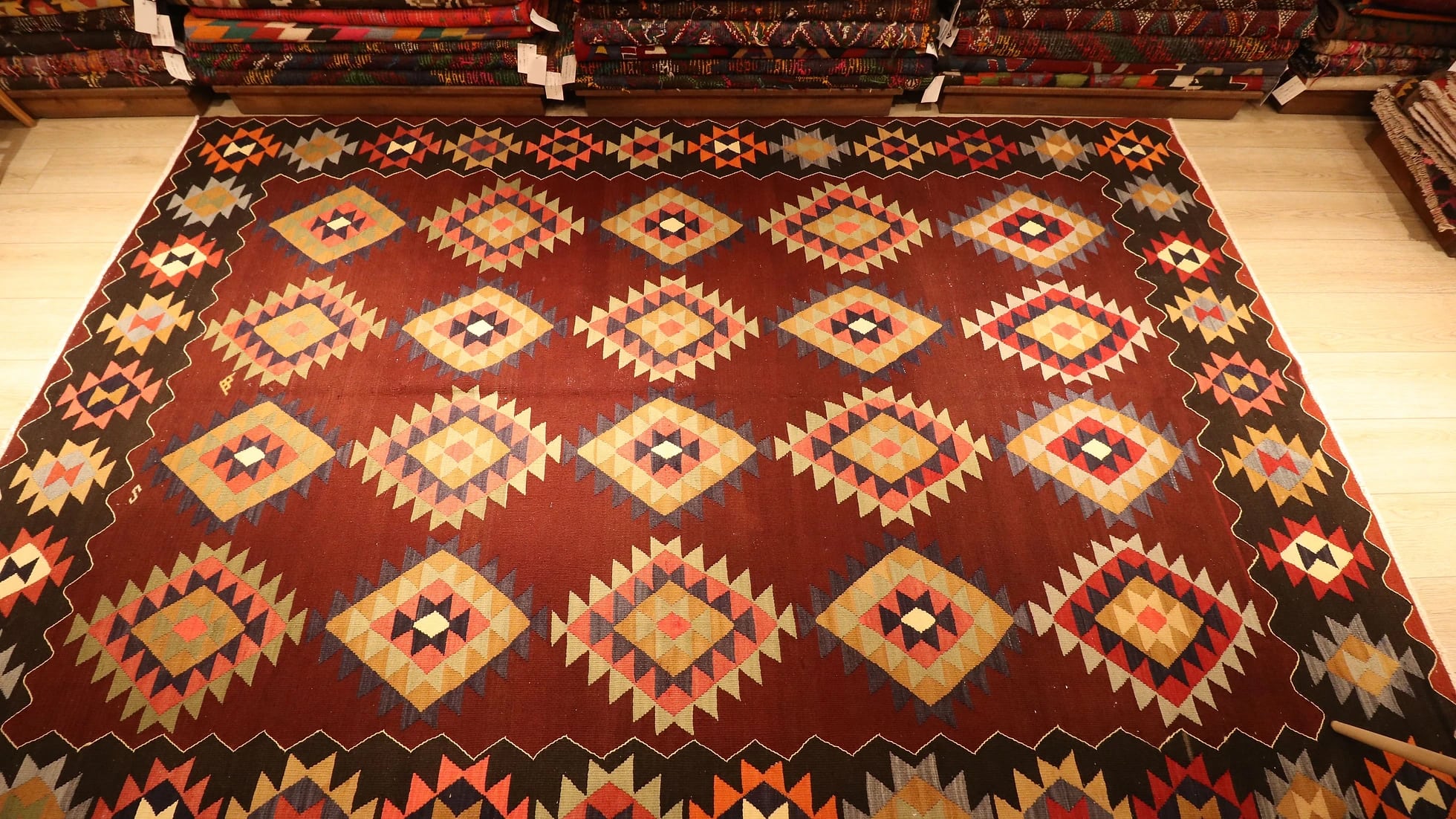 Vintage handwoven oriental Turkish rug in pastel and earth colors adorned with traditional and tribal motifs