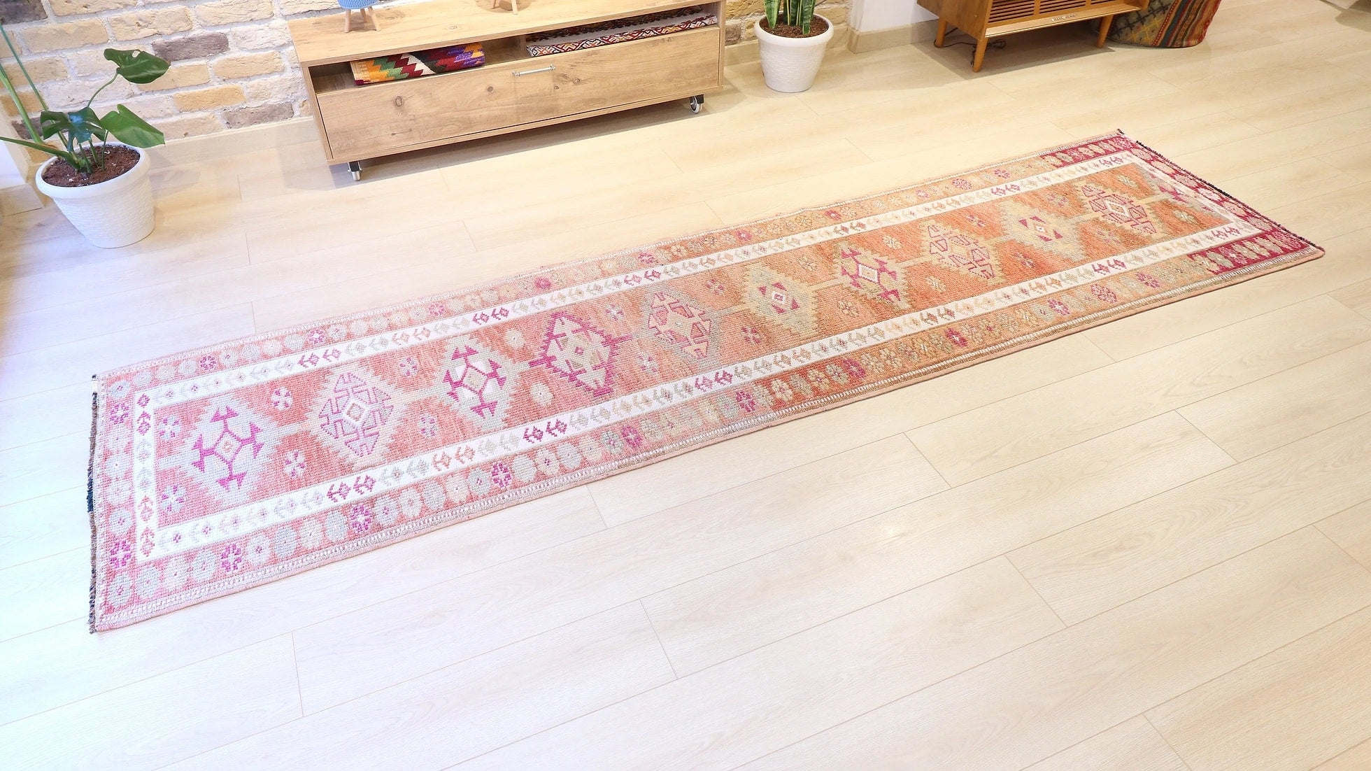 Gorgeous floral Oushak gallery oriental rug from Ushak in earthy, muted and pastel tones with geometric patterns