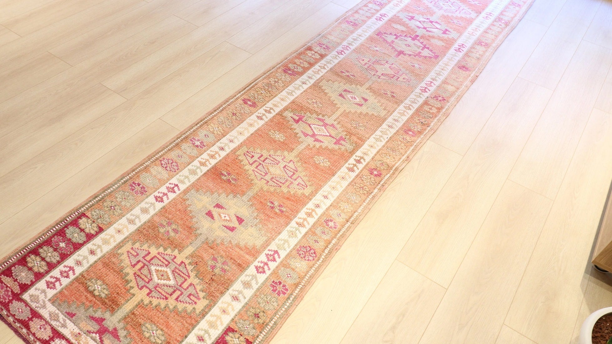 Gorgeous floral Oushak gallery oriental rug from Ushak in earthy, muted and pastel tones with geometric patterns