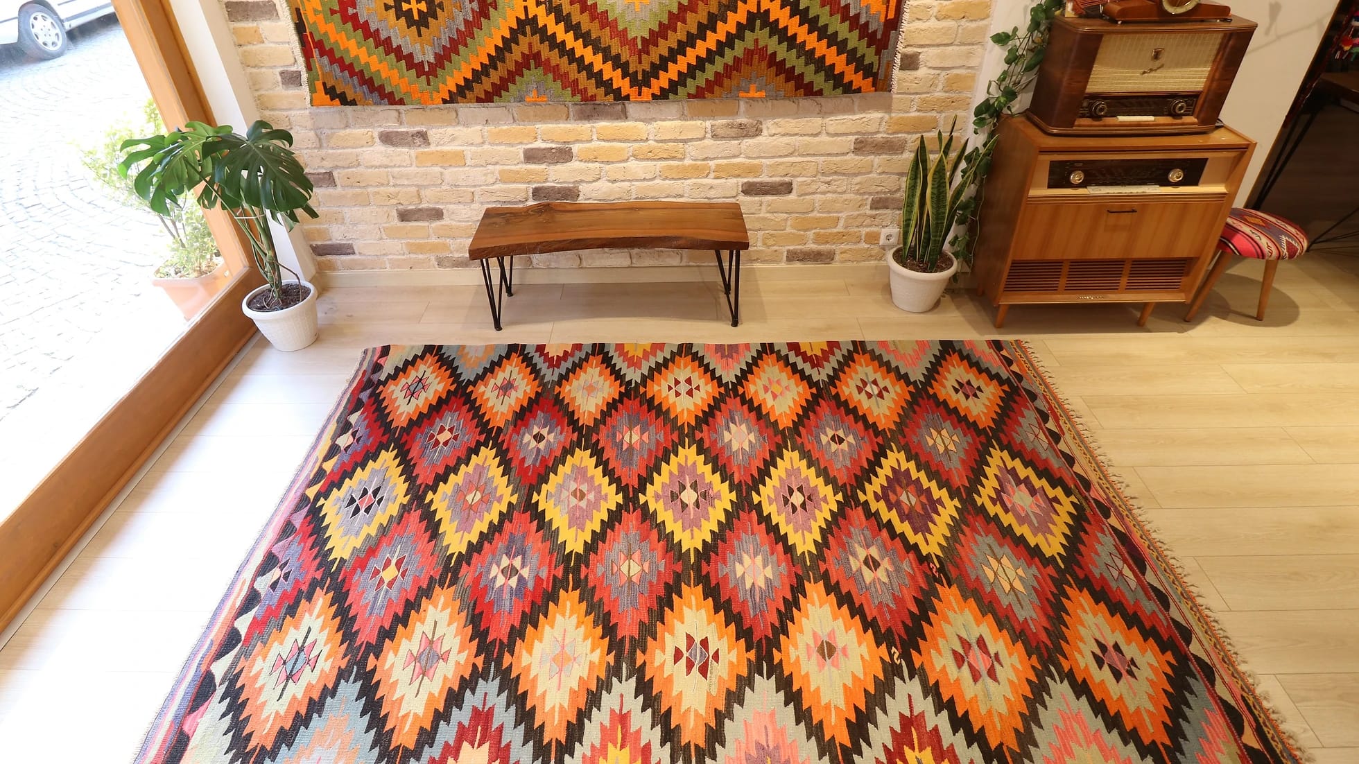 Turkish ethnic tribal rug featuring traditional motifs in vivid and vibrant colors from mid-century