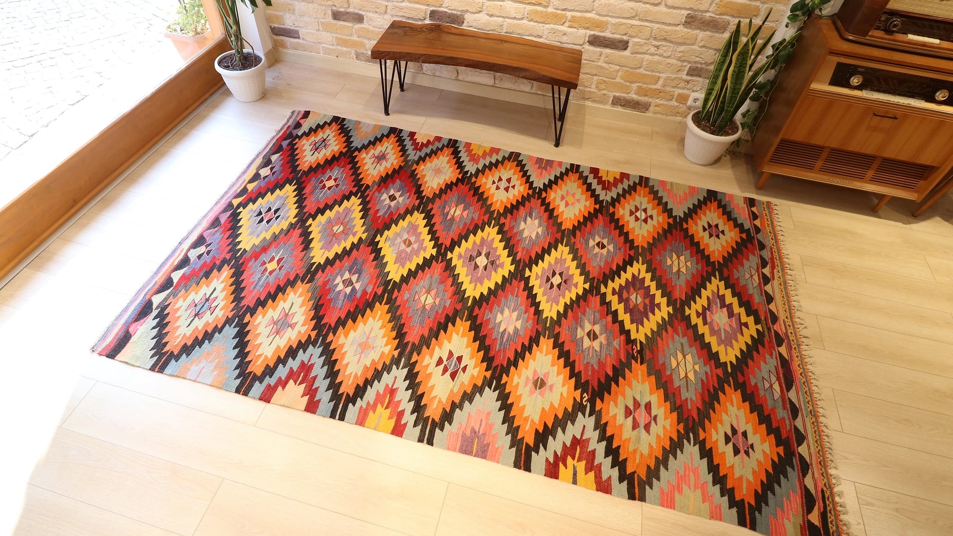 Turkish ethnic tribal rug featuring traditional motifs in vivid and vibrant colors from mid-century