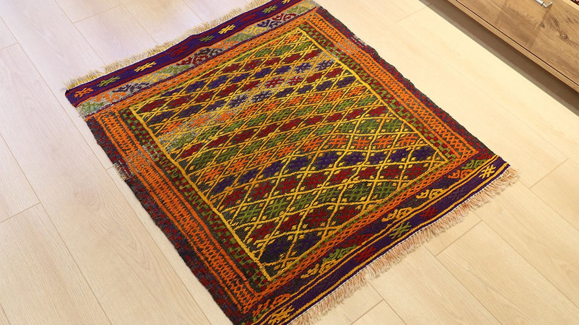 Vintage collector rug from Turkey featuring traditional motifs in vibrant colors