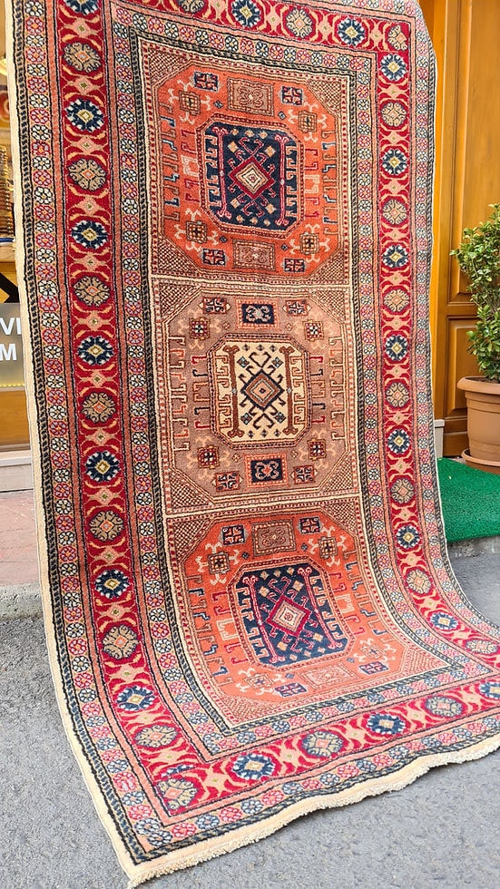 Mid-century Bunyan runner rug from Kayseri, Turkey, circa 1950, 3x7 ft Features three geometric medallions within square frames, surrounded by multi-layered floral borders. Handwoven with superior quality wool using natural dyes, this rug showcases traditional Turkish artistry, ideal for enhancing narrow spaces such as hallways, kitchens, or entryways with timeless elegance.