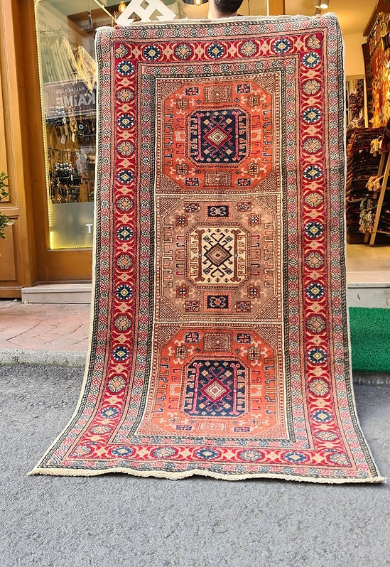 Mid-century Bunyan runner rug from Kayseri, Turkey, circa 1950, 3x7 ft Features three geometric medallions within square frames, surrounded by multi-layered floral borders. Handwoven with superior quality wool using natural dyes, this rug showcases traditional Turkish artistry, ideal for enhancing narrow spaces such as hallways, kitchens, or entryways with timeless elegance.