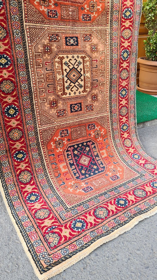 Mid-century Bunyan runner rug from Kayseri, Turkey, circa 1950, 3x7 ft Features three geometric medallions within square frames, surrounded by multi-layered floral borders. Handwoven with superior quality wool using natural dyes, this rug showcases traditional Turkish artistry, ideal for enhancing narrow spaces such as hallways, kitchens, or entryways with timeless elegance.