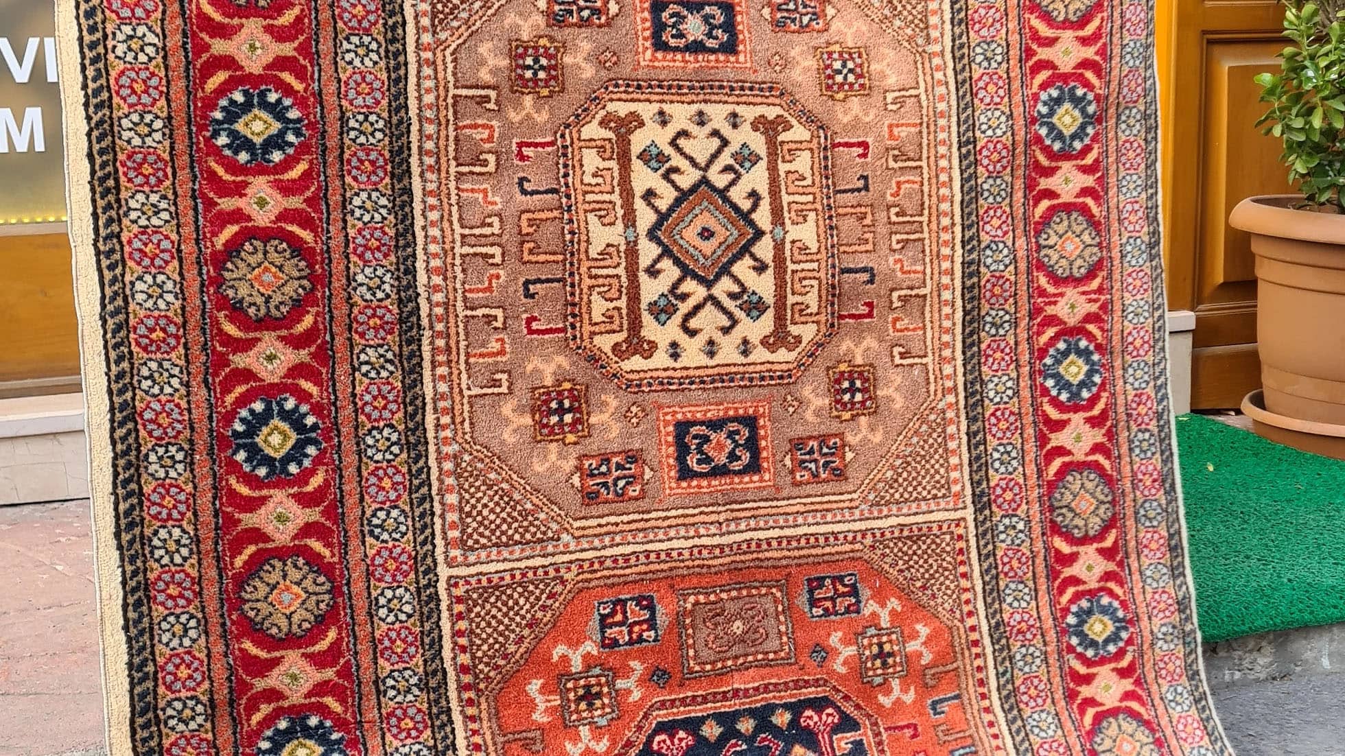 Mid-century Bunyan runner rug from Kayseri, Turkey, circa 1950, 3x7 ft Features three geometric medallions within square frames, surrounded by multi-layered floral borders. Handwoven with superior quality wool using natural dyes, this rug showcases traditional Turkish artistry, ideal for enhancing narrow spaces such as hallways, kitchens, or entryways with timeless elegance.