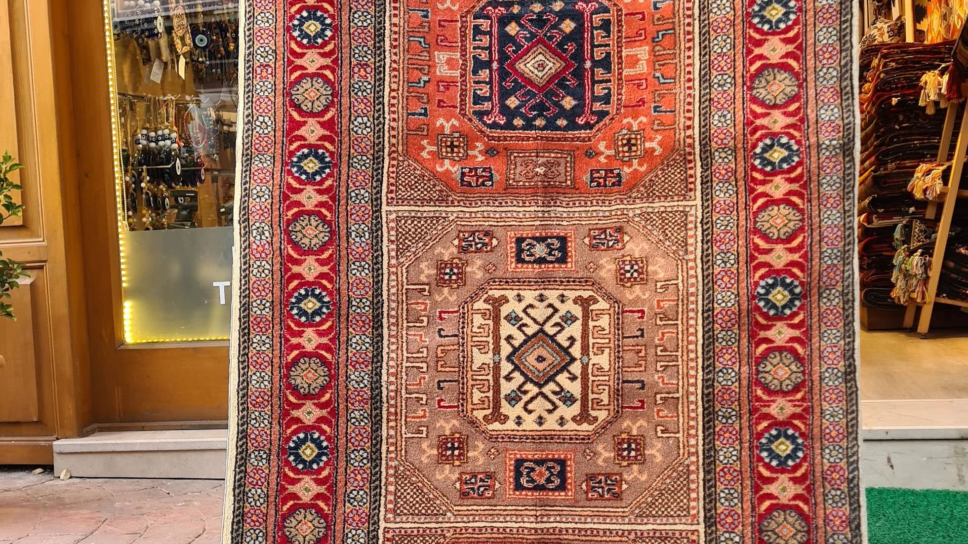 Mid-century Bunyan runner rug from Kayseri, Turkey, circa 1950, 3x7 ft Features three geometric medallions within square frames, surrounded by multi-layered floral borders. Handwoven with superior quality wool using natural dyes, this rug showcases traditional Turkish artistry, ideal for enhancing narrow spaces such as hallways, kitchens, or entryways with timeless elegance.