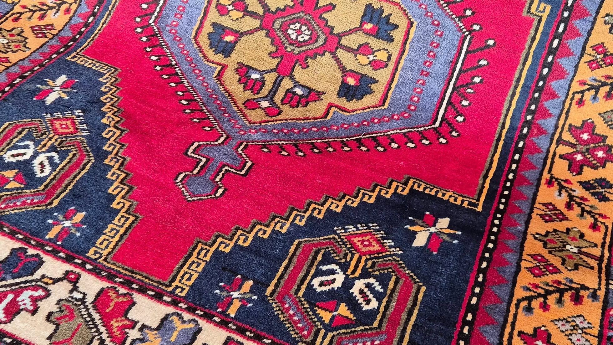 Antique Turkish Yahyali runner rug in hand-spun wool, double-knotted construction, rich madder red palette