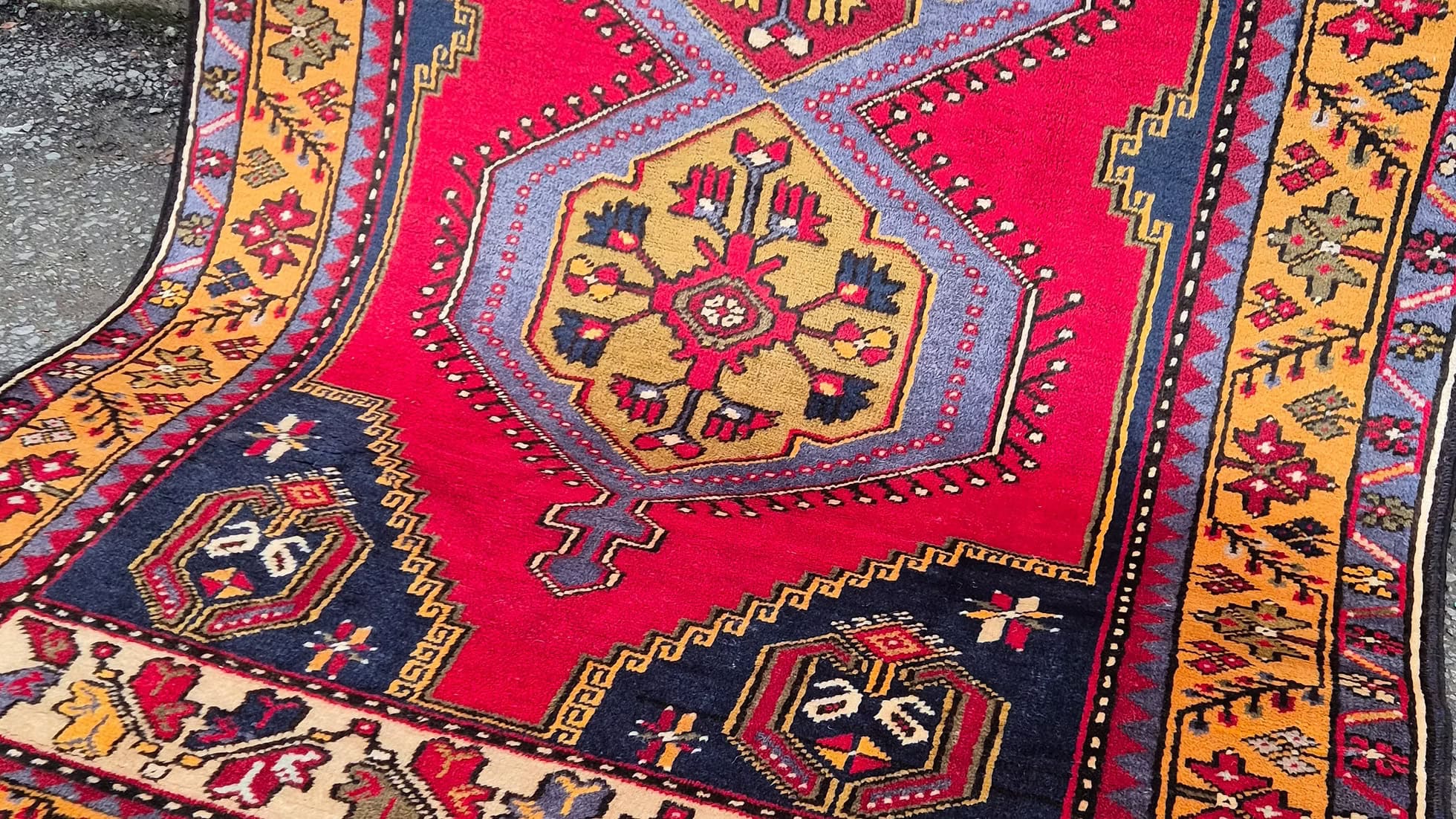 Yahyali wool rug from Kayseri, Turkey featuring geometric medallions in madder red