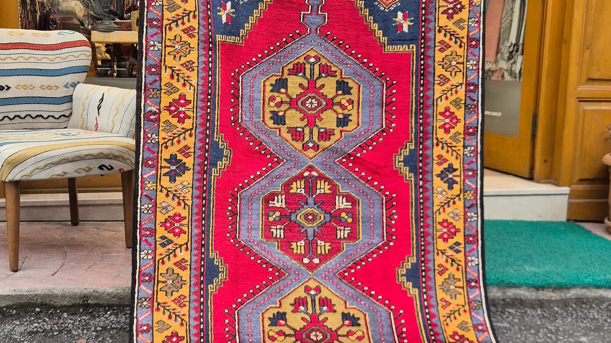 Vintage Turkish hand-knotted Yahyali oriental rug in madder red, saffron gold, and midnight blue