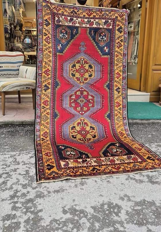 Vintage Turkish hand-knotted Yahyali oriental rug in madder red, saffron gold, and midnight blue
