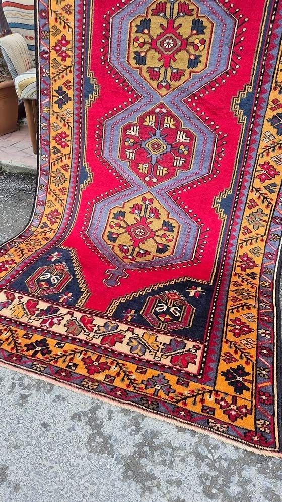 Yahyali wool rug from Kayseri, Turkey featuring geometric medallions in madder red
