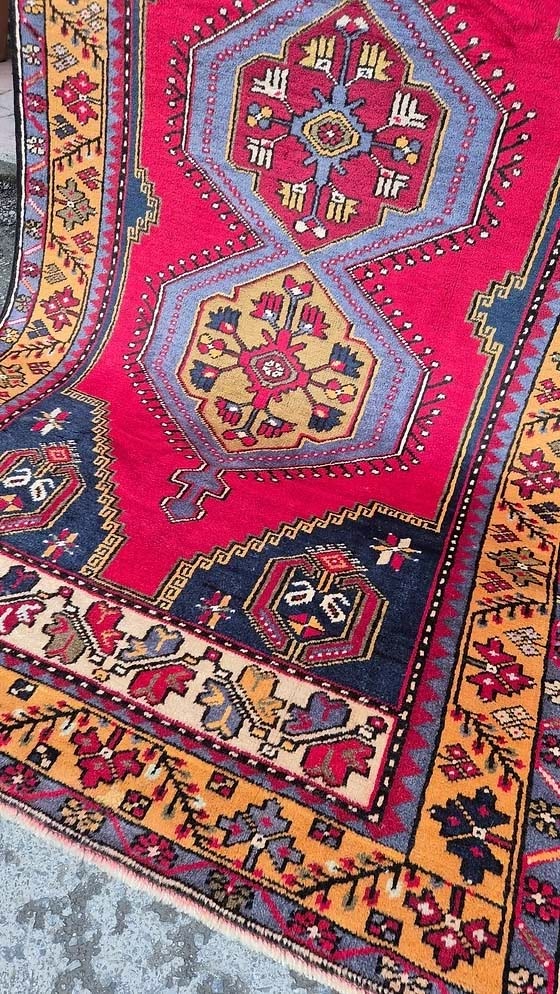 Antique Turkish Yahyali runner rug in hand-spun wool, double-knotted construction, rich madder red palette