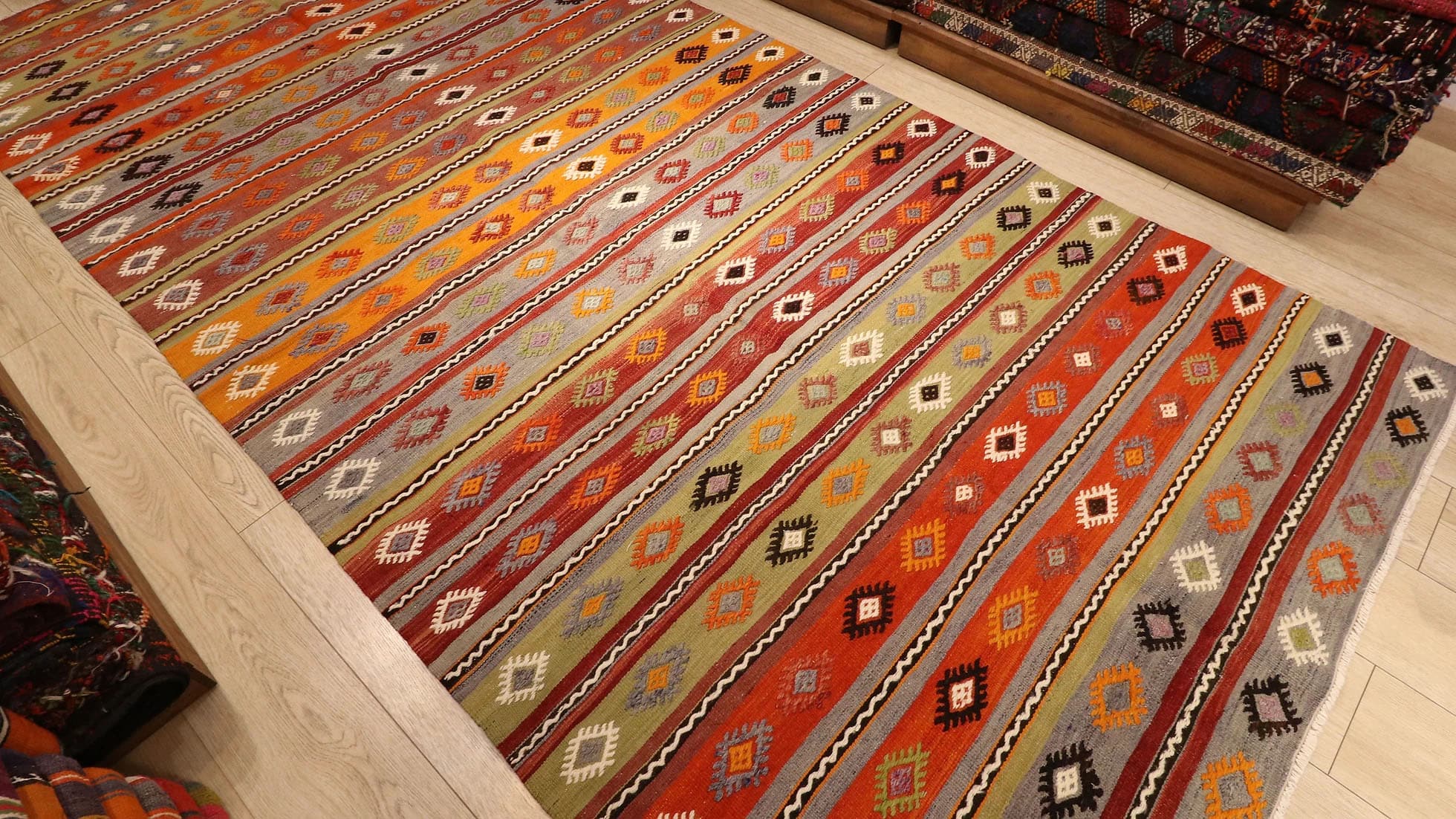 a majestic rustic Kurdish tribal runner rug in earth tones from mid-century by Kilim Couture