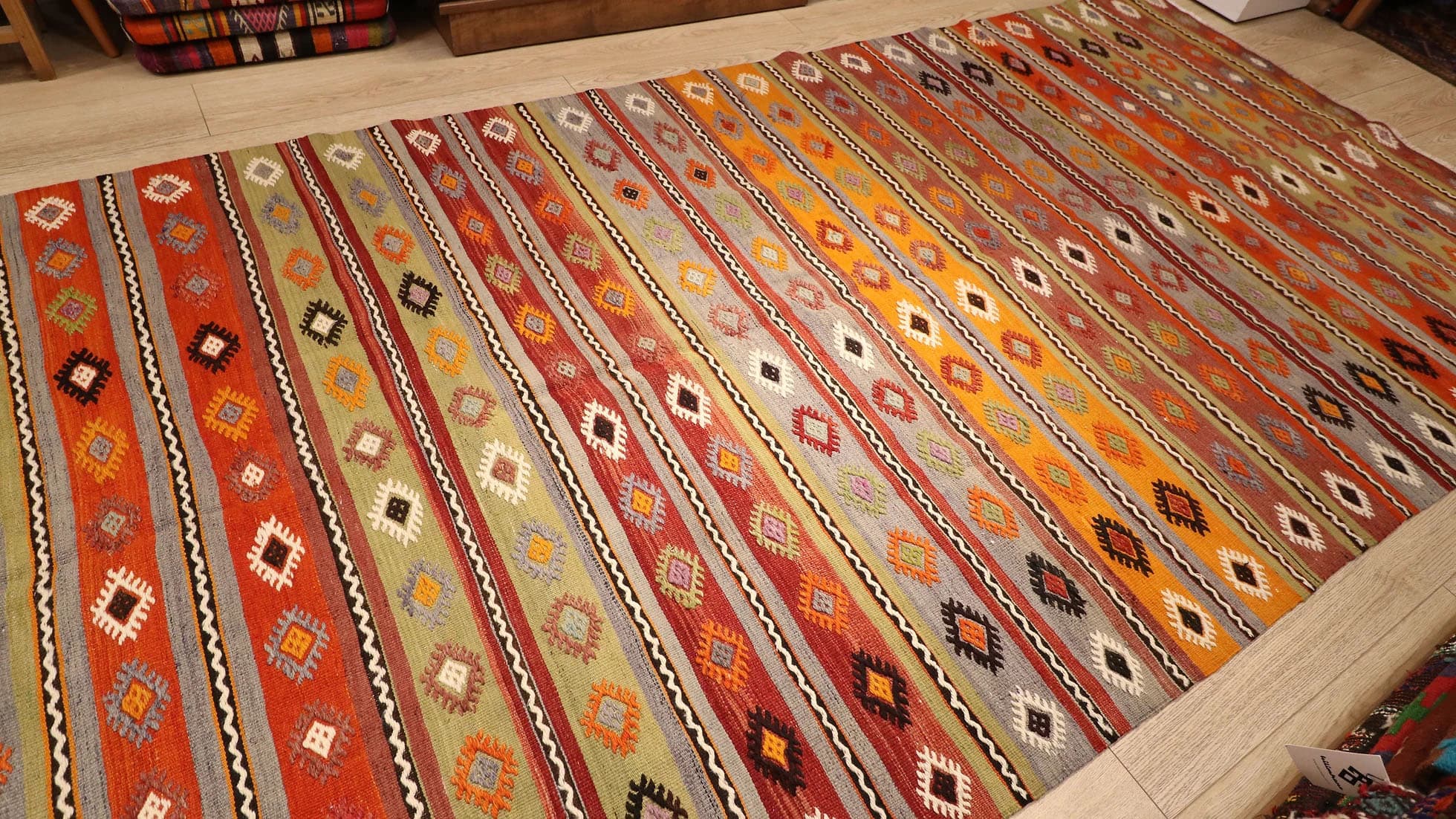 a majestic rustic Kurdish tribal runner rug in earth tones from mid-century by Kilim Couture