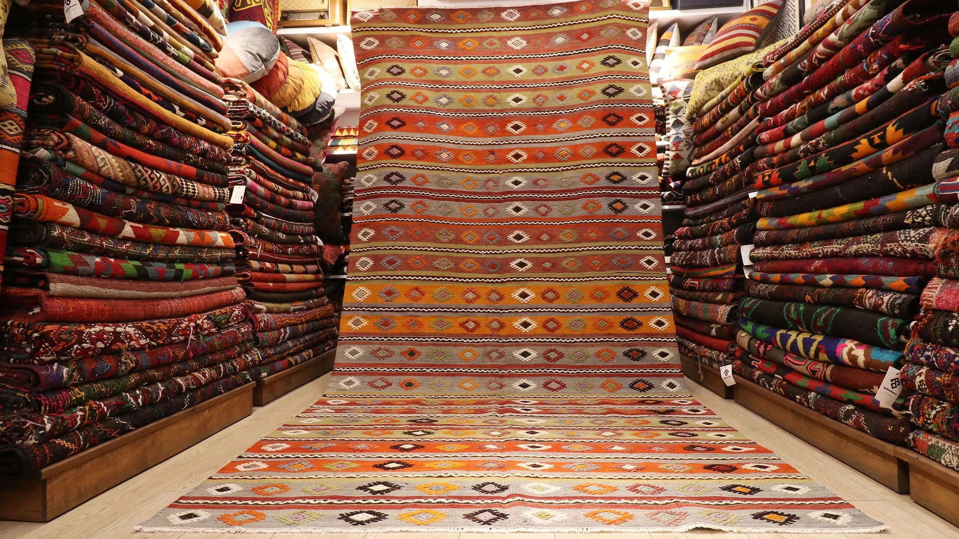 a majestic rustic Kurdish tribal runner rug in earth tones from mid-century by Kilim Couture