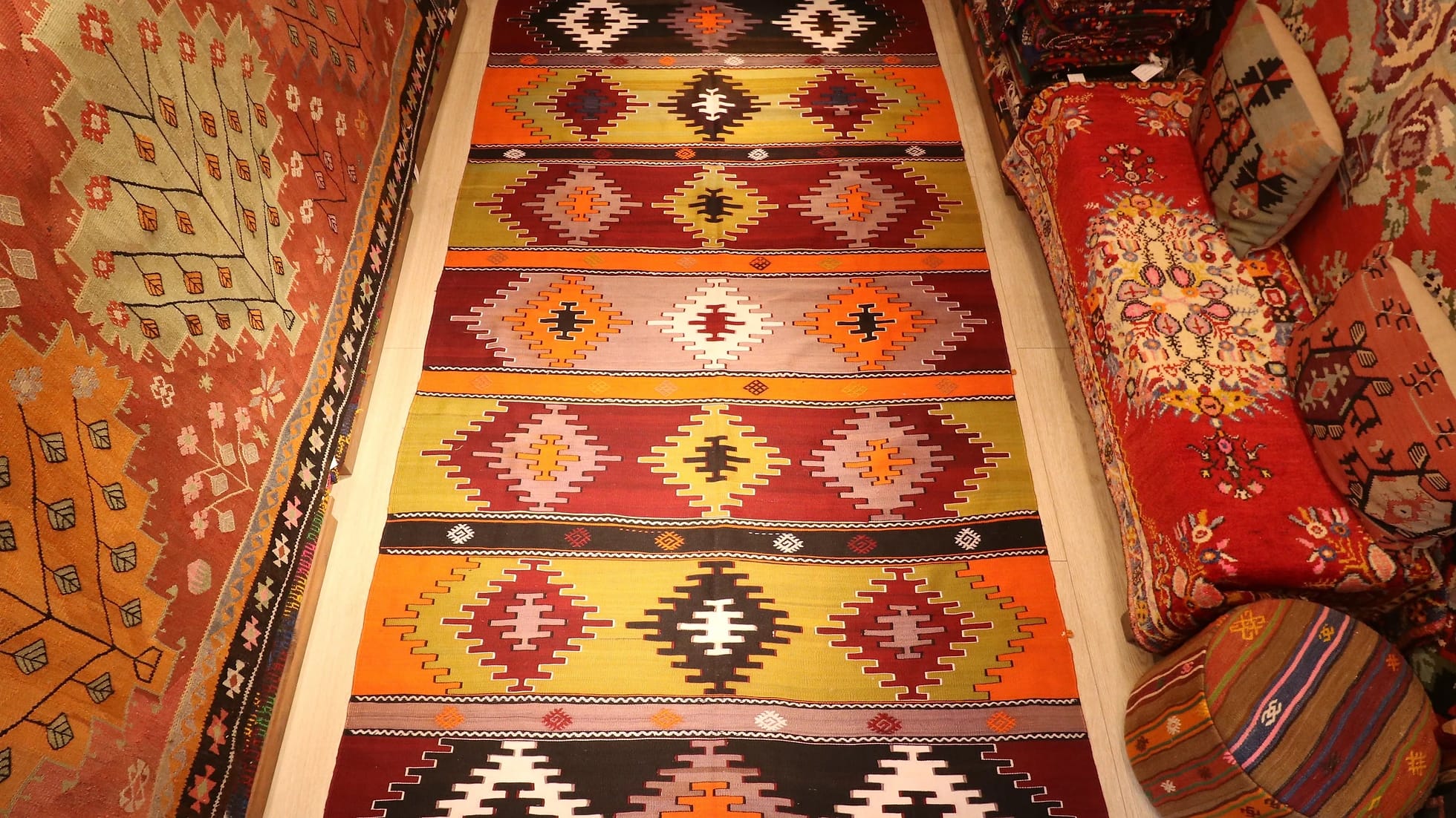 perfect Turkish rustic kilim runner rug in earth tones such as taupe, khaki, and brick red by Kilim Couture New York
