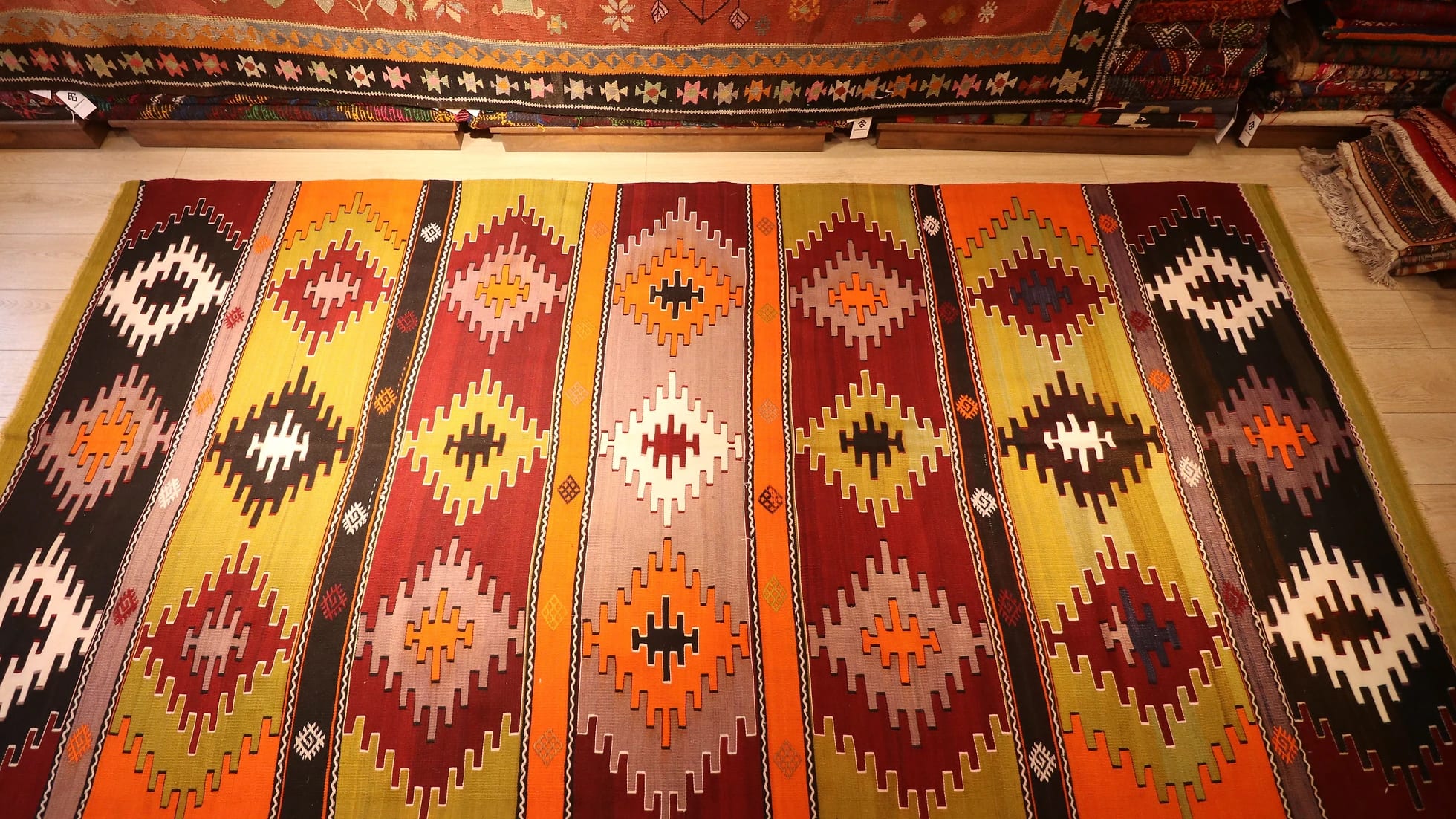 perfect Turkish rustic kilim runner rug in earth tones such as taupe, khaki, and brick red by Kilim Couture New York