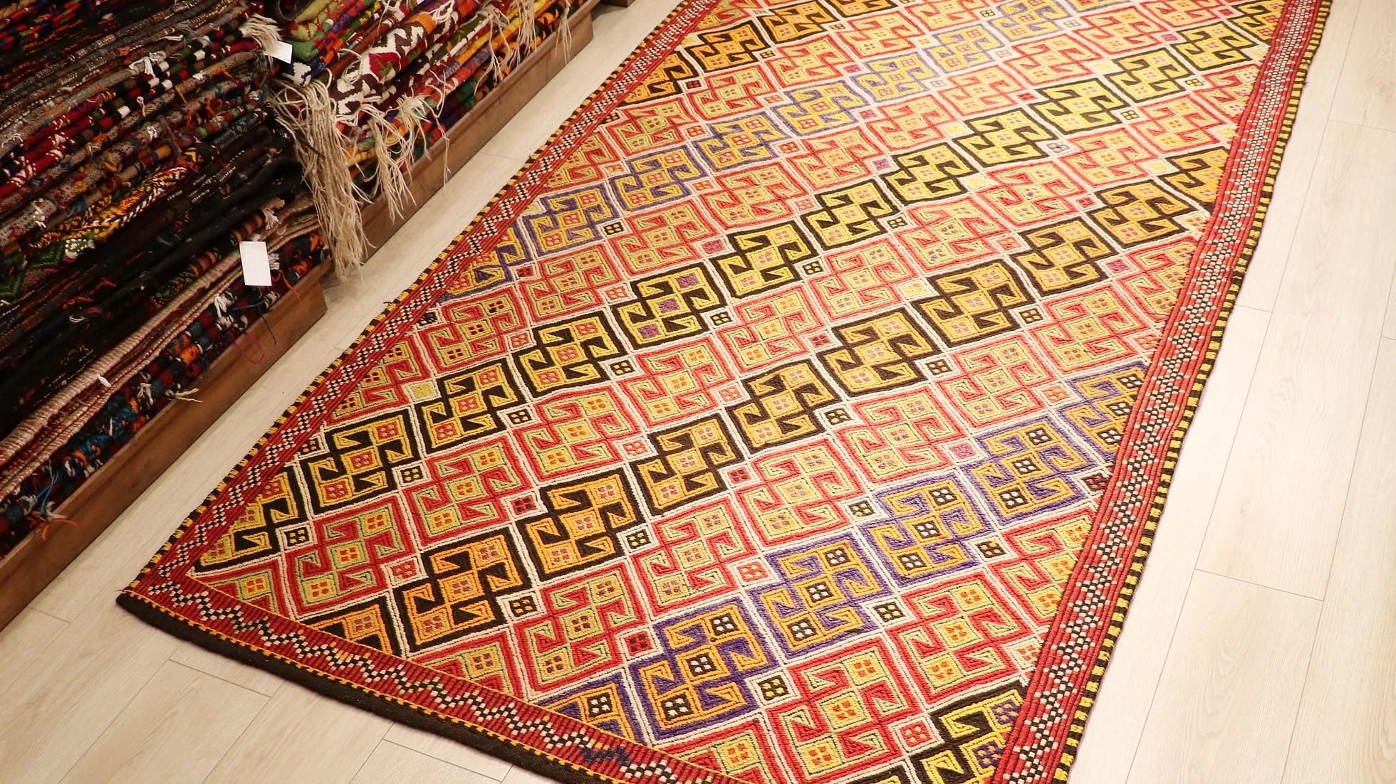 colorful handwoven oriental Turkish rug in wool featuring traditional tribal motifs from the mid-century