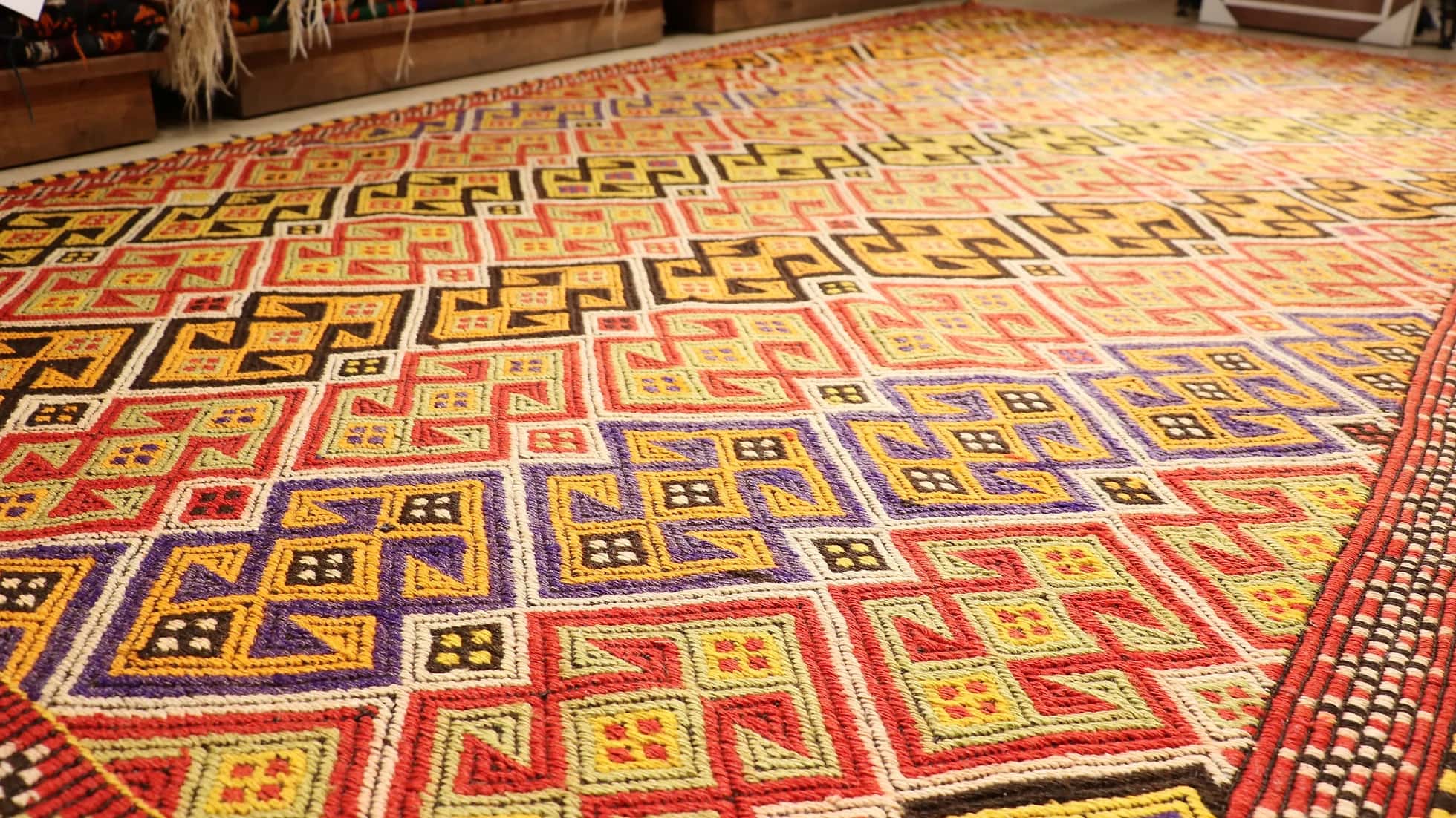 colorful handwoven oriental Turkish rug in wool featuring traditional tribal motifs from the mid-century