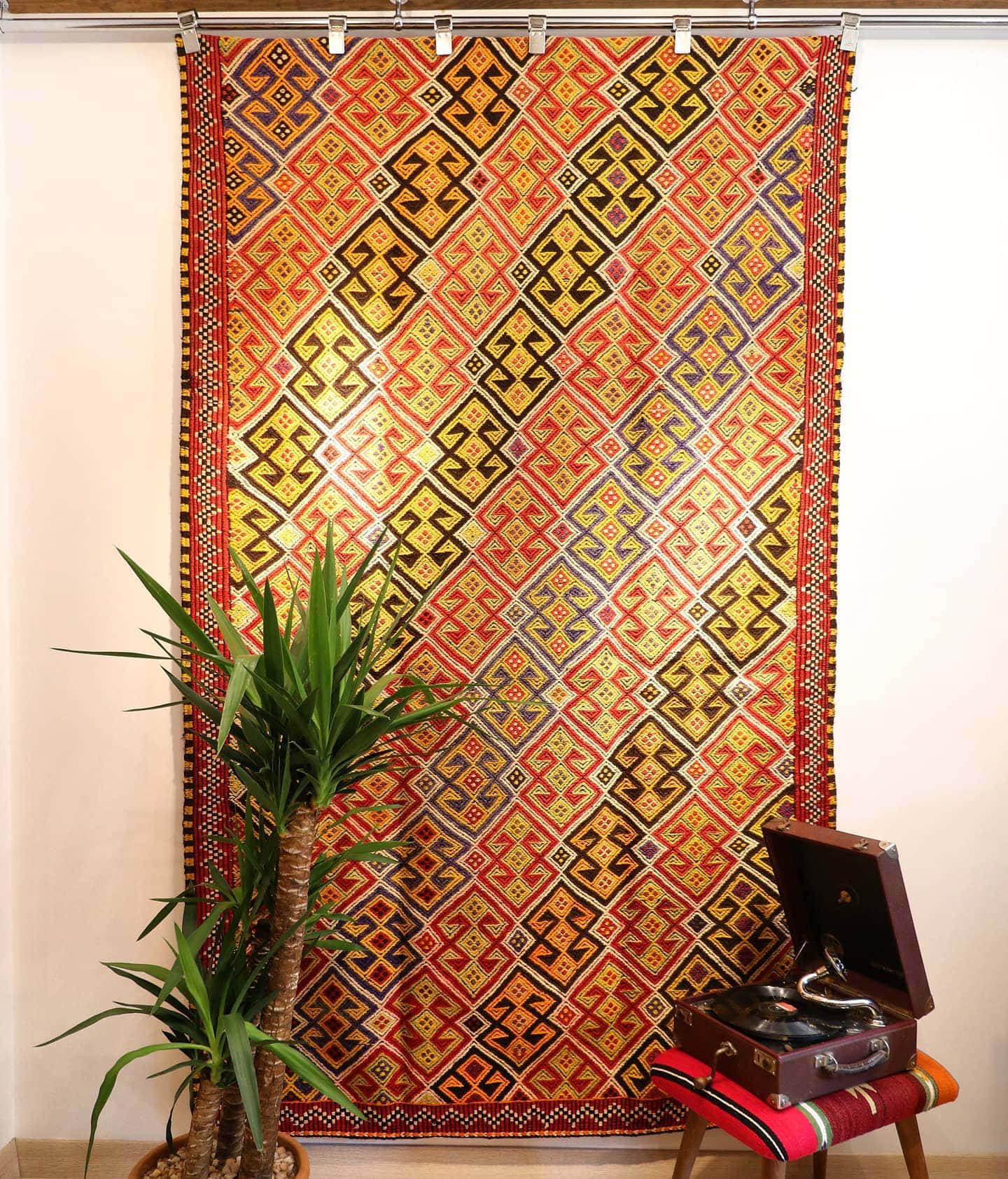 colorful handwoven oriental Turkish rug in wool featuring traditional tribal motifs from the mid-century