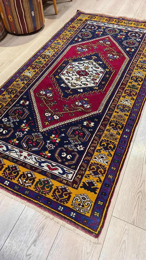 1950s Yahyali Turkish hand-knotted runner in scarlet, navy, and gold – a statement piece for curated interiors, perfect for sophisticated design schemes at Kilim Couture New York.