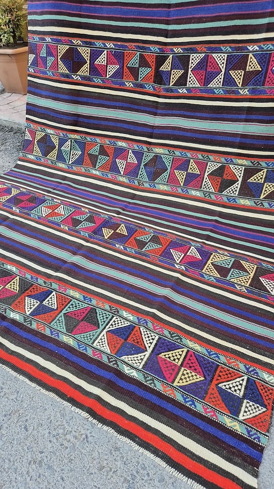 Colorful turkish textile kilim with geometric patterns and stripes