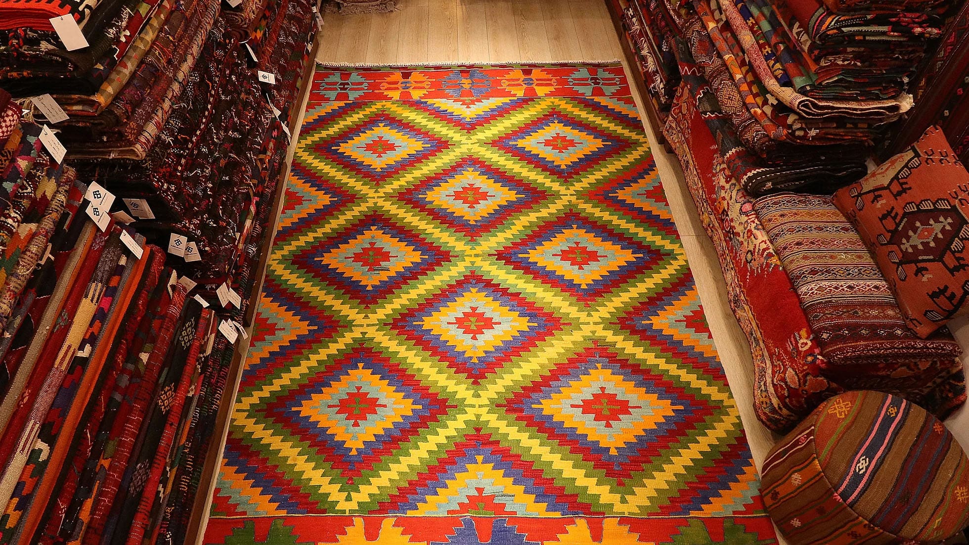 vibrant, vivid, and colorful vintage Turkish rug in geometric patterns woven sustainably in Denizli, Turkey