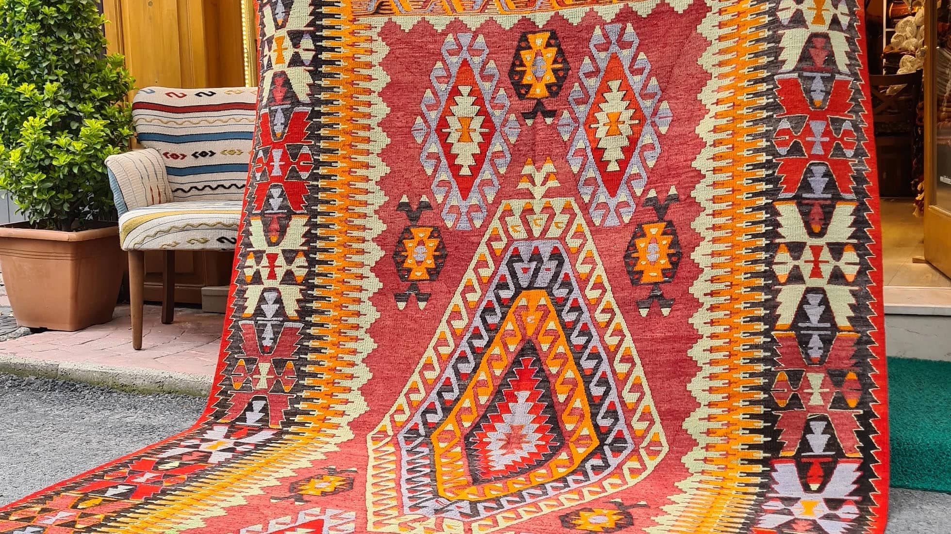 an elegant mid-century oriental kilim rug from Cal village in Denizli, handpicked by Kilim Couture New York in faded and muted pastel tones