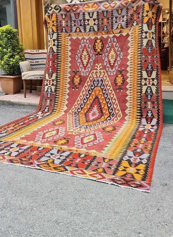 an elegant mid-century oriental kilim rug from Cal village in Denizli, handpicked by Kilim Couture New York in faded and muted pastel tones
