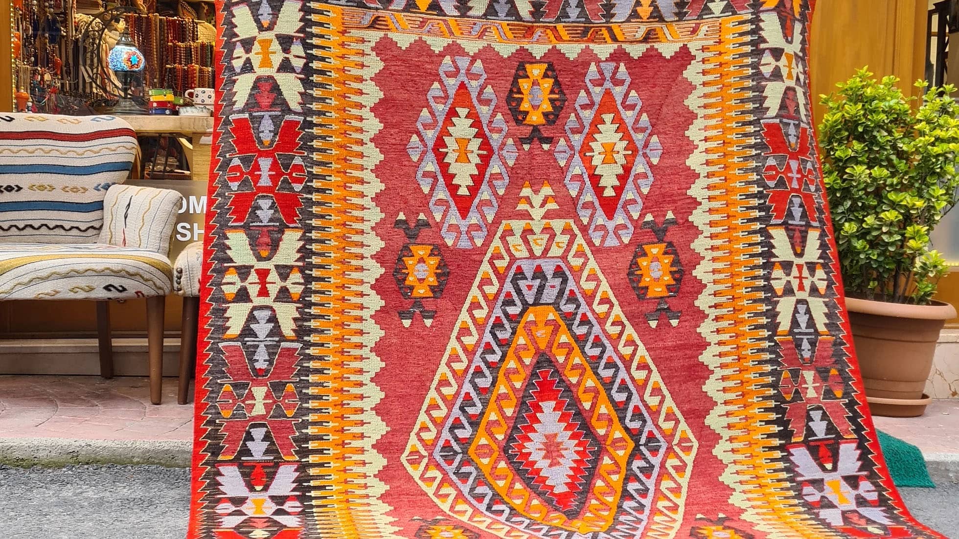 an elegant mid-century oriental kilim rug from Cal village in Denizli, handpicked by Kilim Couture New York in faded and muted pastel tones