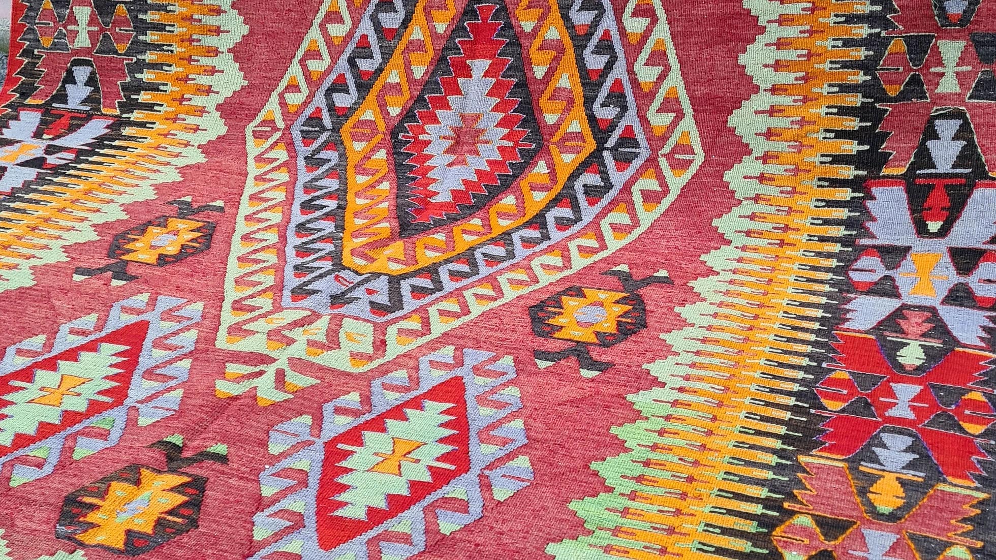 an elegant mid-century oriental kilim rug from Cal village in Denizli, handpicked by Kilim Couture New York in faded and muted pastel tones