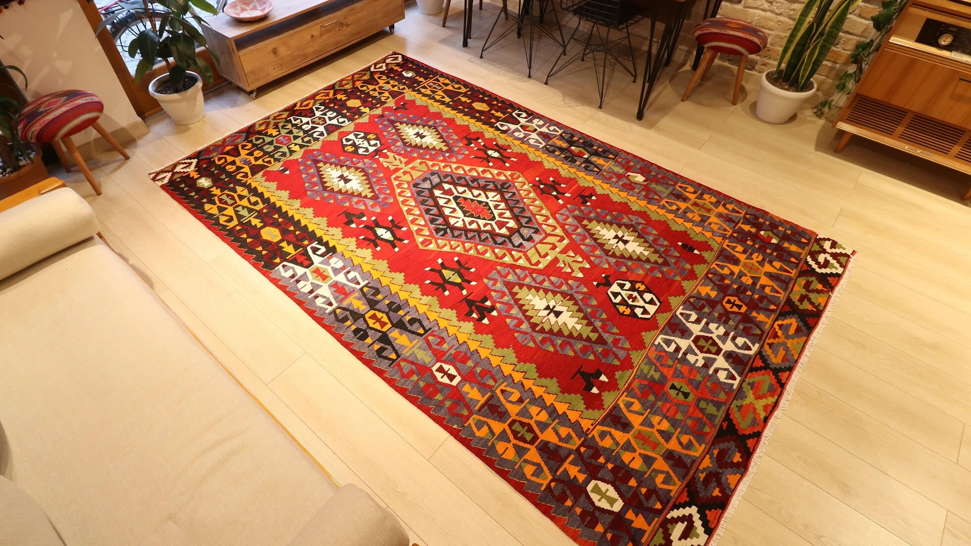 precious Cal oriental Turkish rug handwoven in 1960s featuring many traditional Anatolian motifs in passionate red and muted earth tones