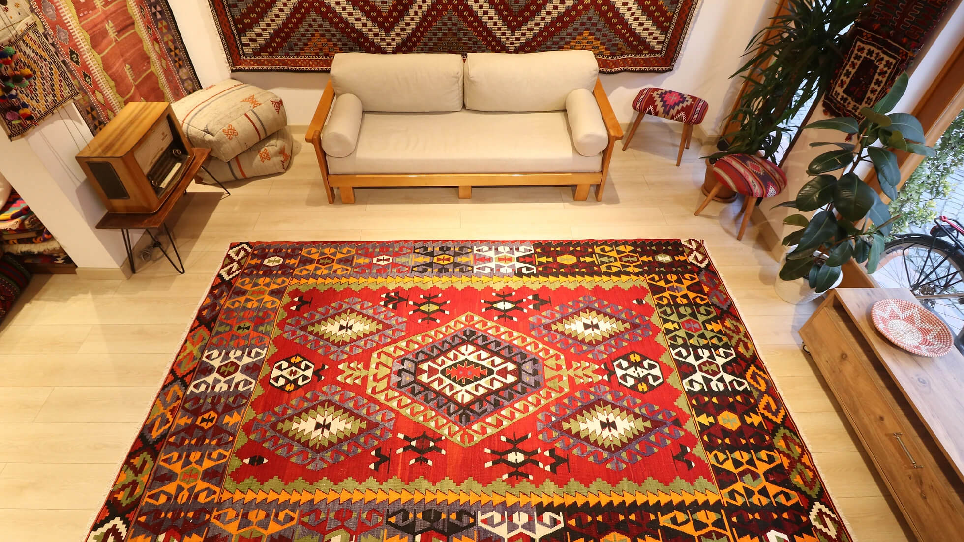 precious Cal oriental Turkish rug handwoven in 1960s featuring many traditional Anatolian motifs in passionate red and muted earth tones