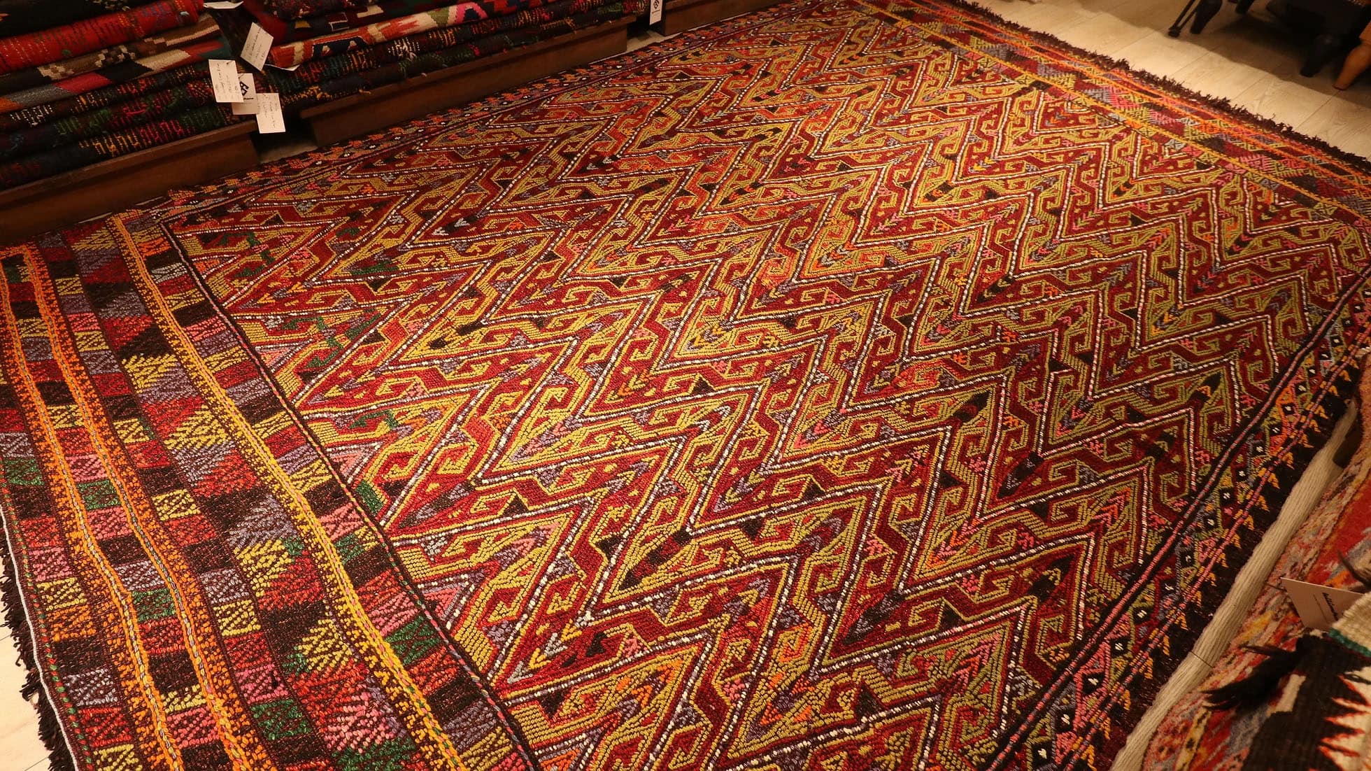 the perfect oriental Turkish rug in rustic colors and traditional hands on hips motifs by Kilim Couture New York rug gallery