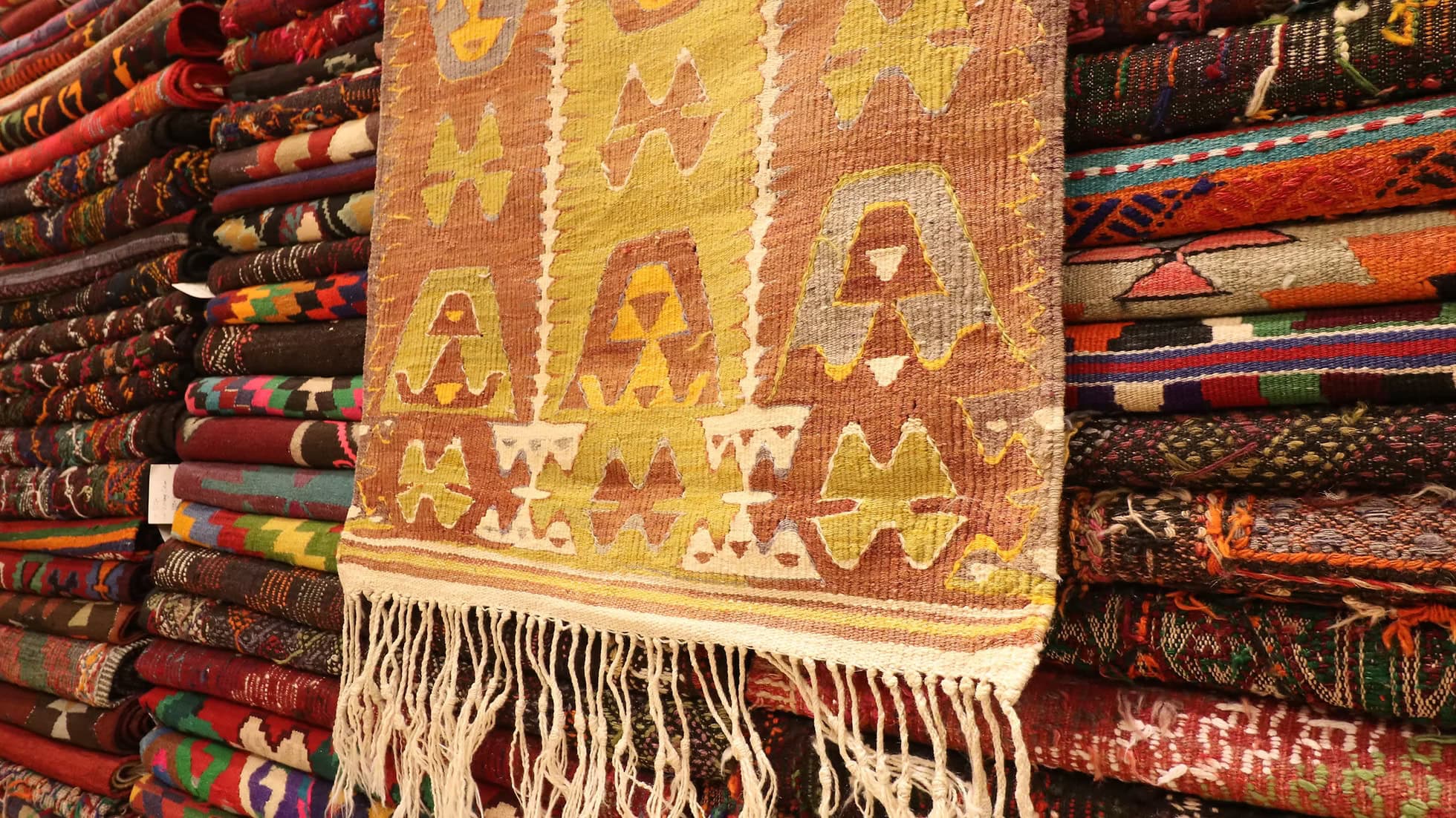 1940s Turkish Barak wool flat-weave rug with a refined muted palette of red, green and ivory.