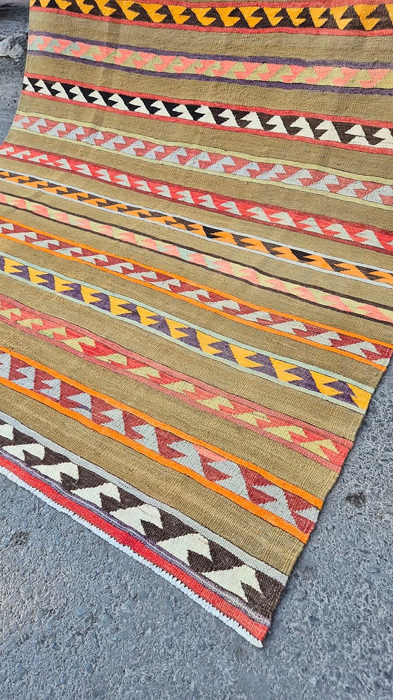 Close-up of antique tribal Anatolian rug with hook motifs by Kilim Couture New York Rug Store