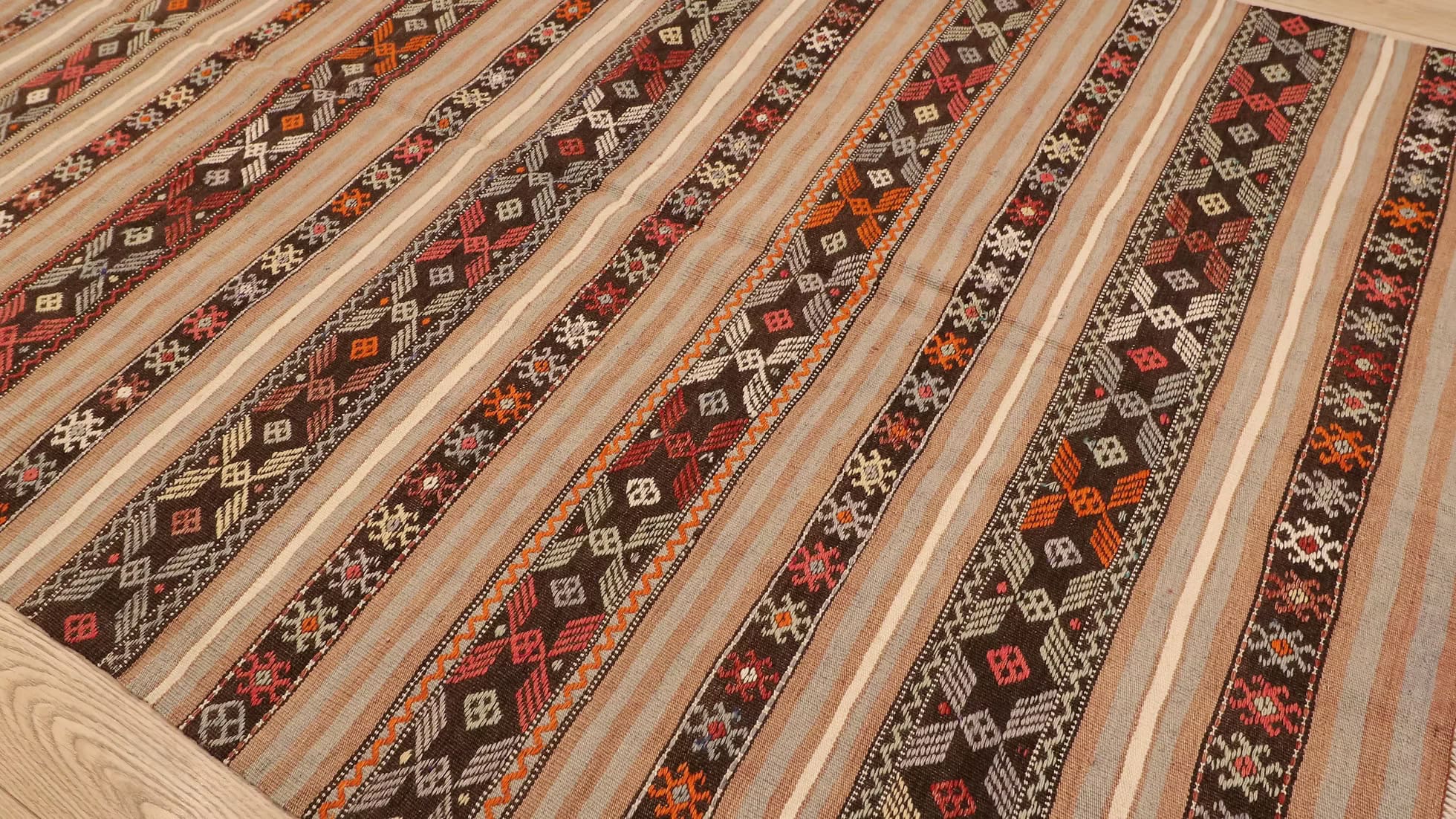 Handwoven Vintage Turkish Kilim, featuring intricate motifs and bold design. A beautiful addition to southern-style homes, from Kilim Couture’s exclusive collection of antique handwoven rugs.