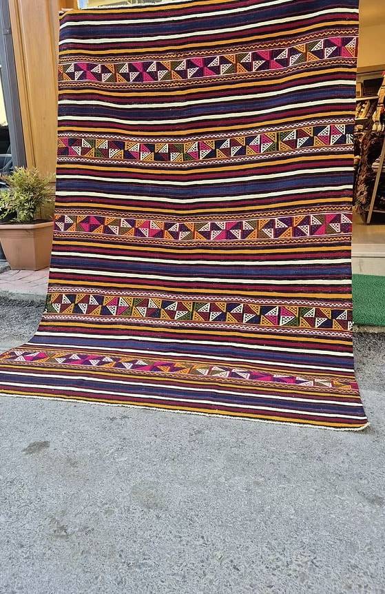 Authentic Turkish textile kilim rug with bold multicolor stripes, perfect for interior designers.