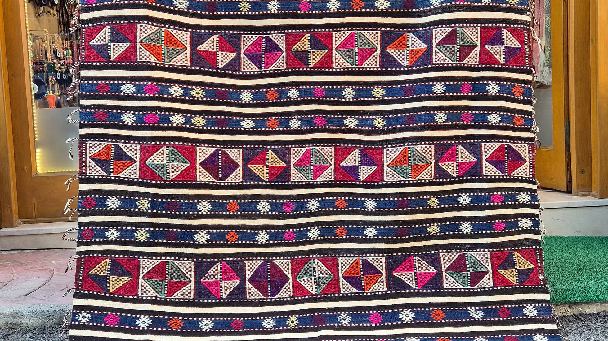 5x8 Turkish area rug with rare vertical tassels, offering a unique accent for eclectic spaces.
