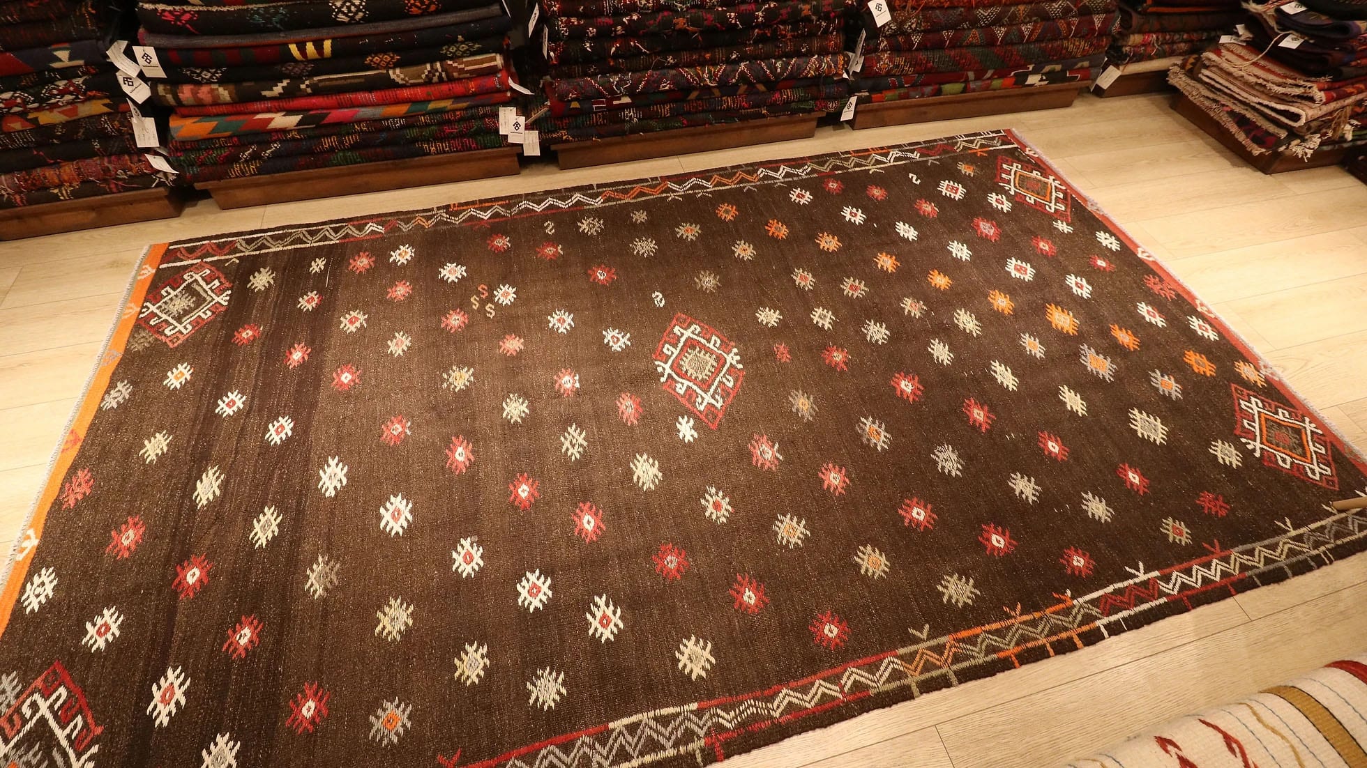 Handwoven vintage Balikesir tribal flat-weave rug from the 1950s, part of the Kilim Couture New York collection, styled with kilim décor in a curated showroom