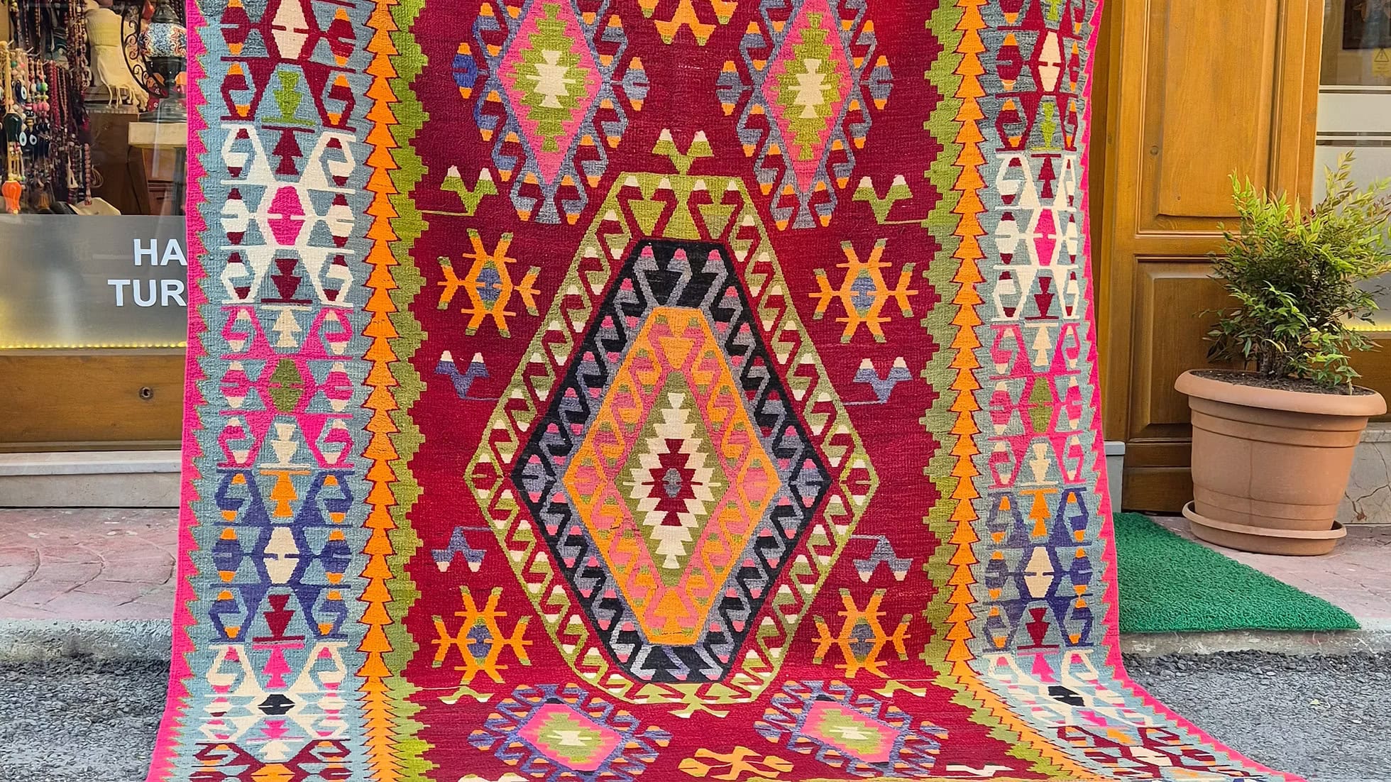 Authentic vintage Turkish kilim rug with mythological dragon and "hands on hips" fertility symbols