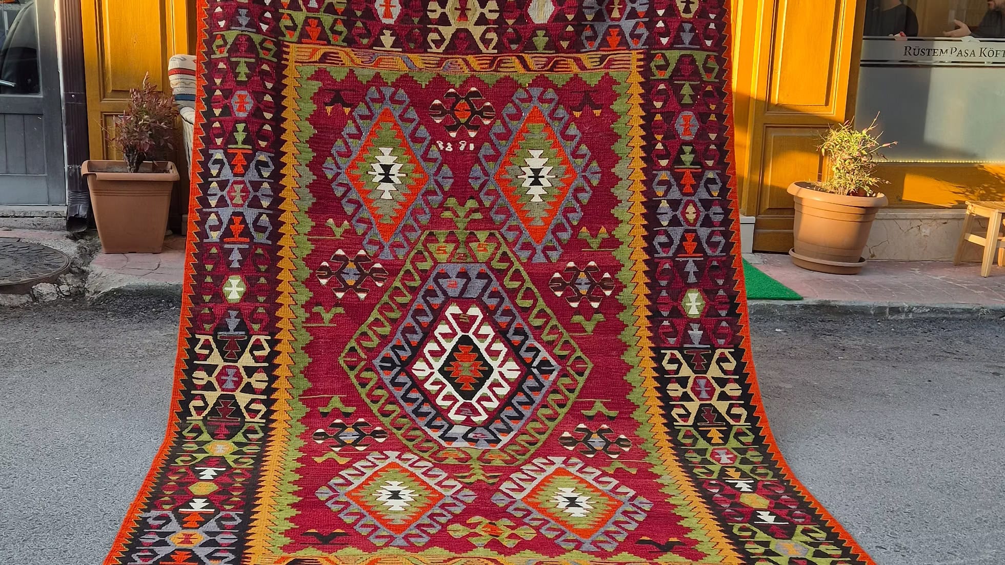 Vintage handwoven flat-weave rug with central geometric medallion from Denizli Turkey