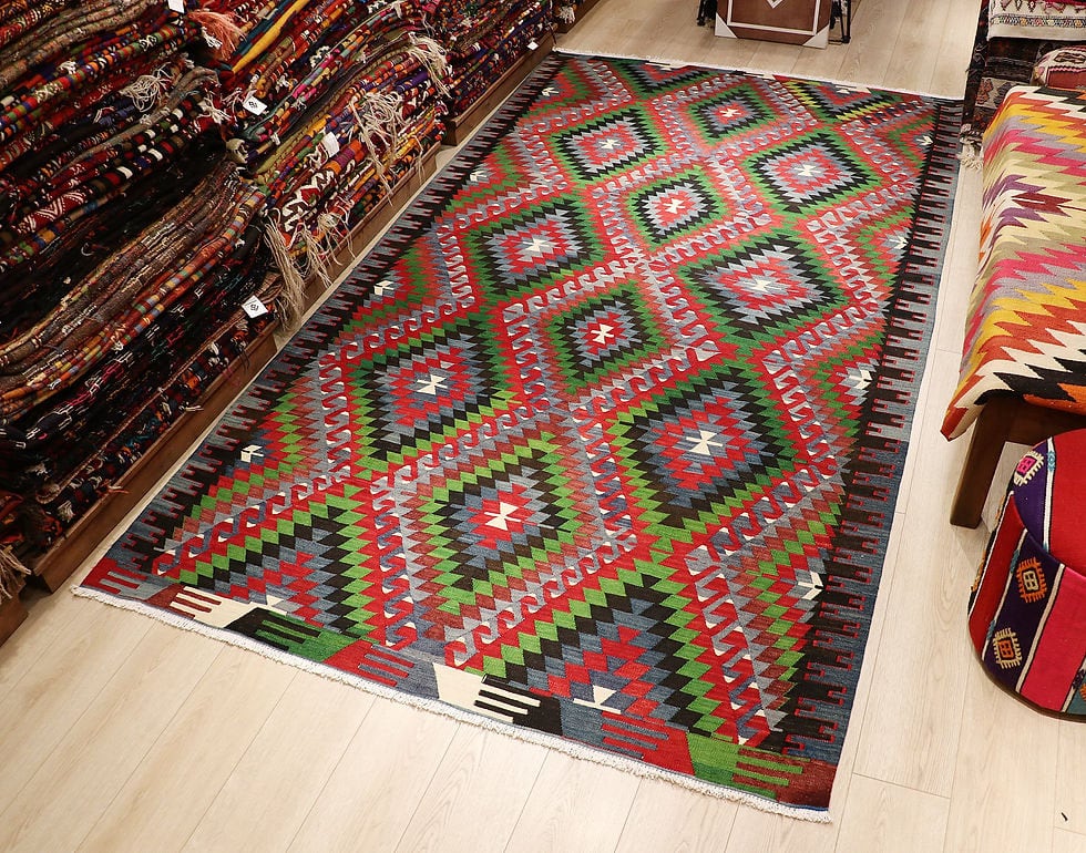 Vintage Turkish Denizli Kilim. This rare 1950s handwoven kilim from Denizli, Turkey, features a striking royal crimson backdrop with intricate 'comb' border motifs in onyx truffle and smoky gray. Measuring 6x10, its bold lozenge pattern embodies the rich craftsmanship of Anatolian weaving. A timeless fusion of history and elegance, this versatile heirloom rug adds warmth and sophistication to any space.