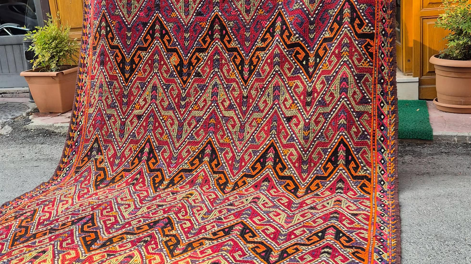 Designer Turkish Rug featuring bold geometric deisgn for interiors combining rustic charm and modern aesthetic for creative projects.