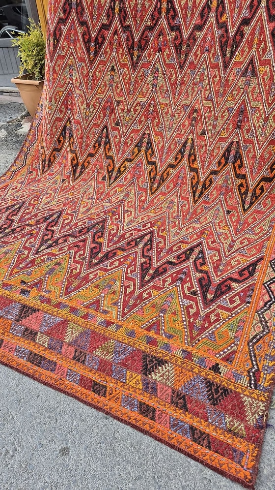 Bold and painterly Turkish kilim rug showcasing tribal patterns — a perfect addition for interior and set decorators seeking a textured, layered look.