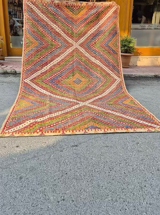 Handwoven vintage Konya Soumak rug showcasing intricate tribal geometric patterns and detailed brocading.